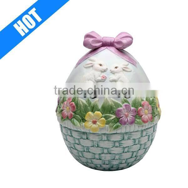 ceramic egg shaped cookie jar with flowers and rabbits