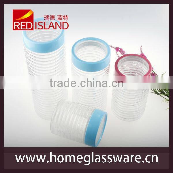 cylindrical food storage glass jar with plastic lid