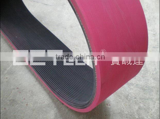 Rubber ribbed belt coated with rubber