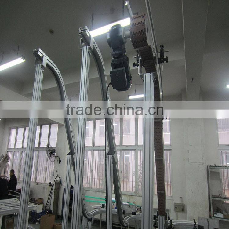 Vertical bottle clamping conveyors system