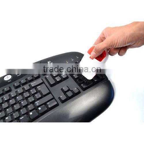Plastic paper clip holder with keyboard cleaner