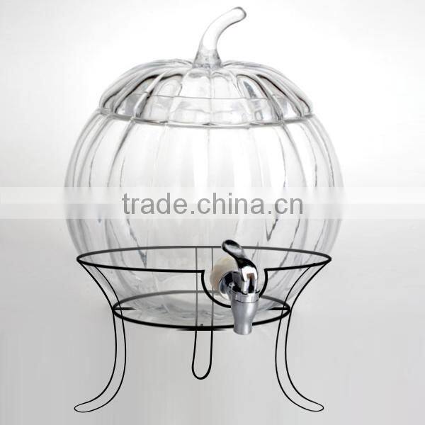 The shape of a pumpkin glass dispenser with metal stand