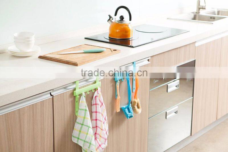 Multipurposed pothook behind the kitchen door