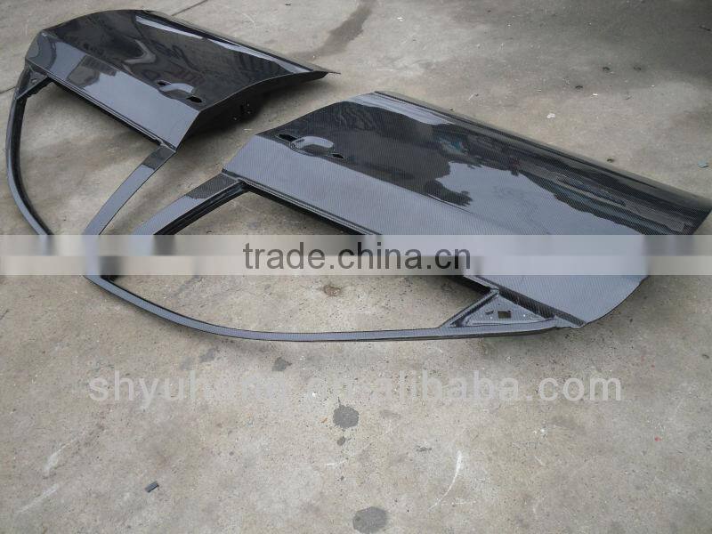 carbon fiber door before and after for GRB STI