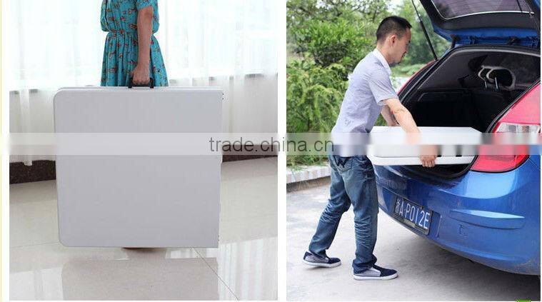 6-foot center-fold multipurpose table with carrying handle and lock
