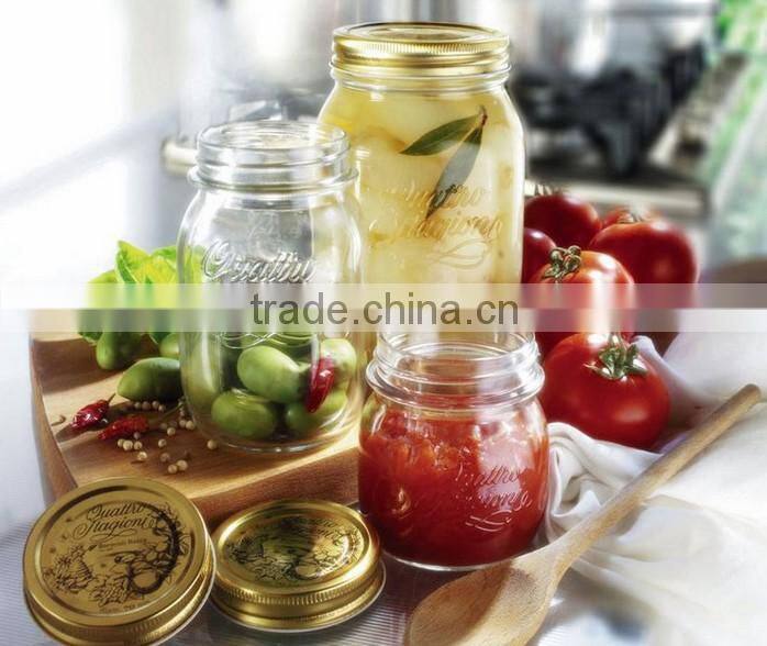 Glass storage jar with gold color metal lid