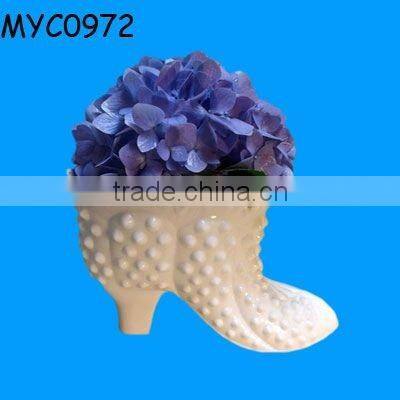 High-heeled shoe vase