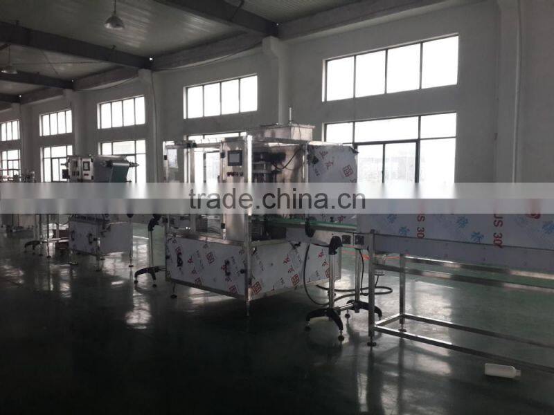 GMP standard automatic bottle filling machine