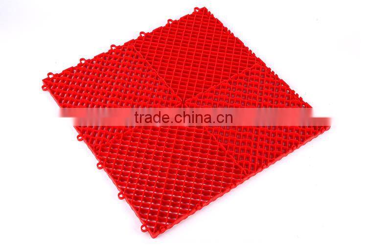 Anti-slip and fluid drainage interlocking plastic floor tiles for store rooms