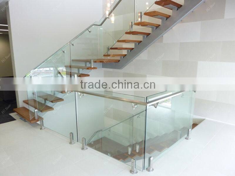 Indoor wood step straight staircase with glass railing