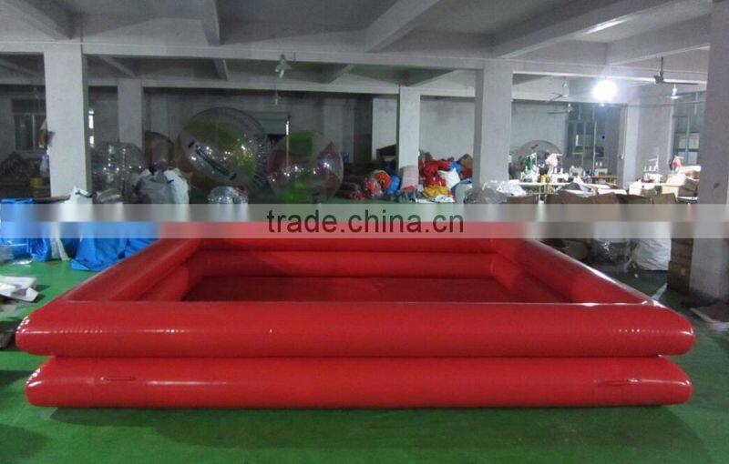 inflatable swimming pool floating on water deployed