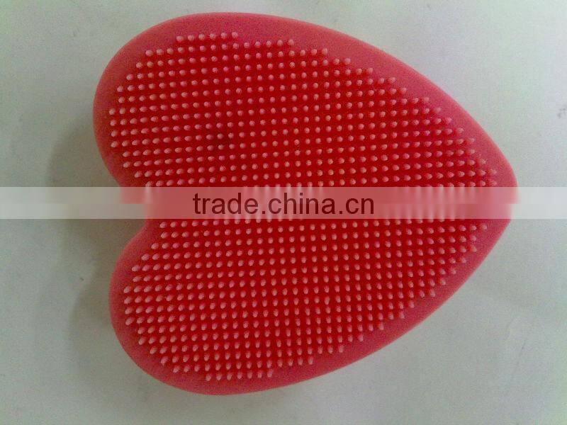 Heart shaped silicone face massage brush