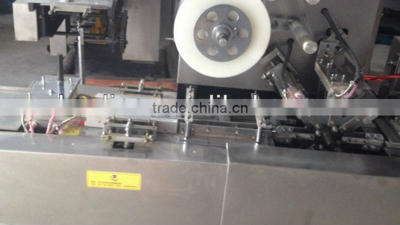 Automatic cellophane overwrapping machine
