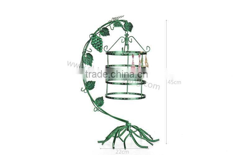 Metal display stand for jewelry with a birdcage for earrings