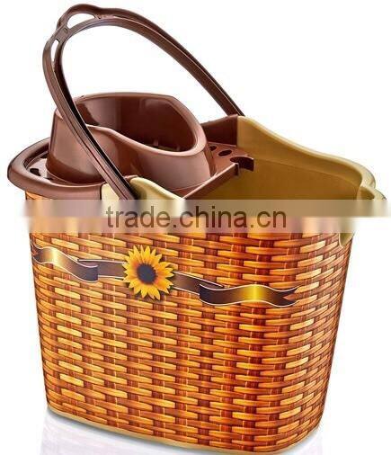 Plastic cleaning bucket very good design with plastic handle with its squeezer and 4 wheels under