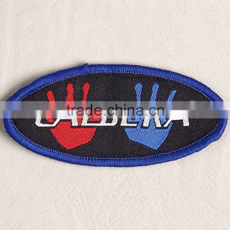 Customize elliptical shaped woven tag with binding for boy's brocade sweater