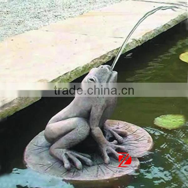 antique stone frog fountains on a lotus leaf