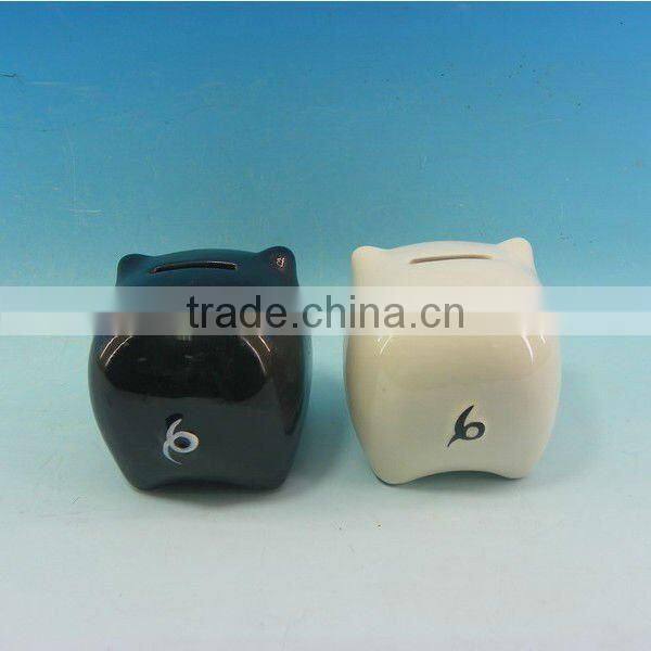 White and black ceramic piggy bank