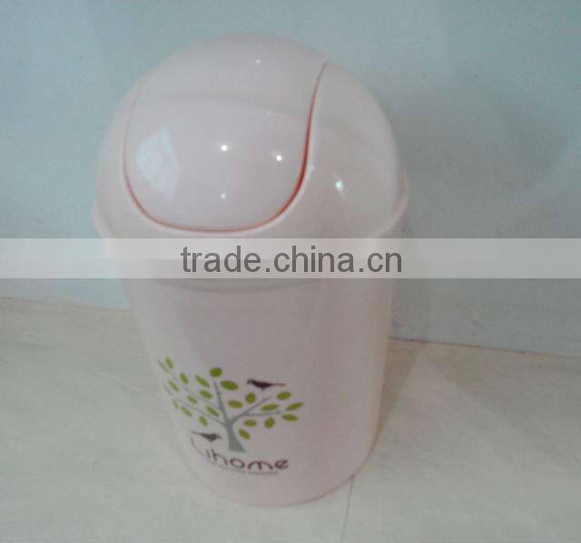 Round swing-top plastic trash can