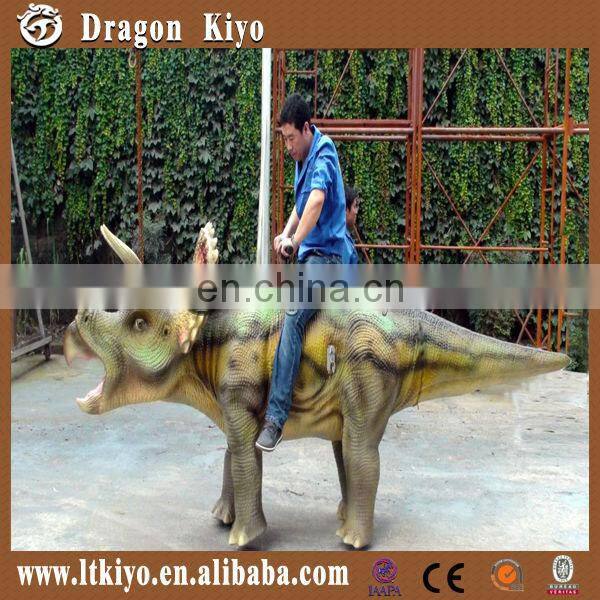 amusement park walking and riding dinosaur triceratops
