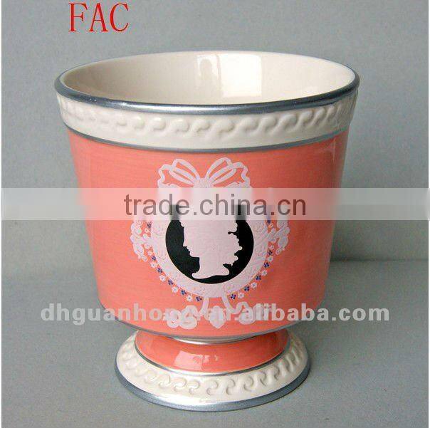 Stock ceramic flower pot in pink color round shape