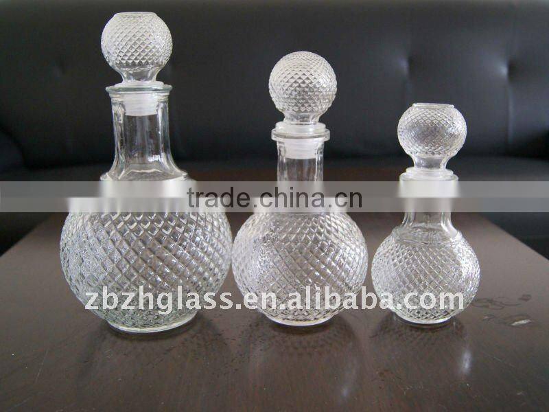 round clear glass wine bottles