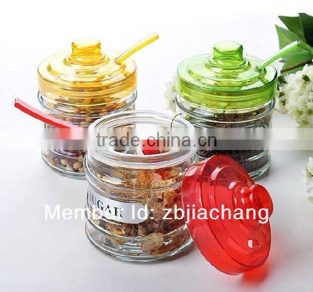 glass spice box with plastic cap and spoon