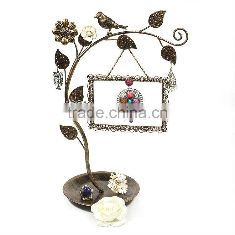 tree jewerly display stand with a birdcage