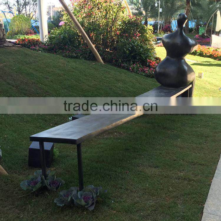 Fiberglass man character on bench