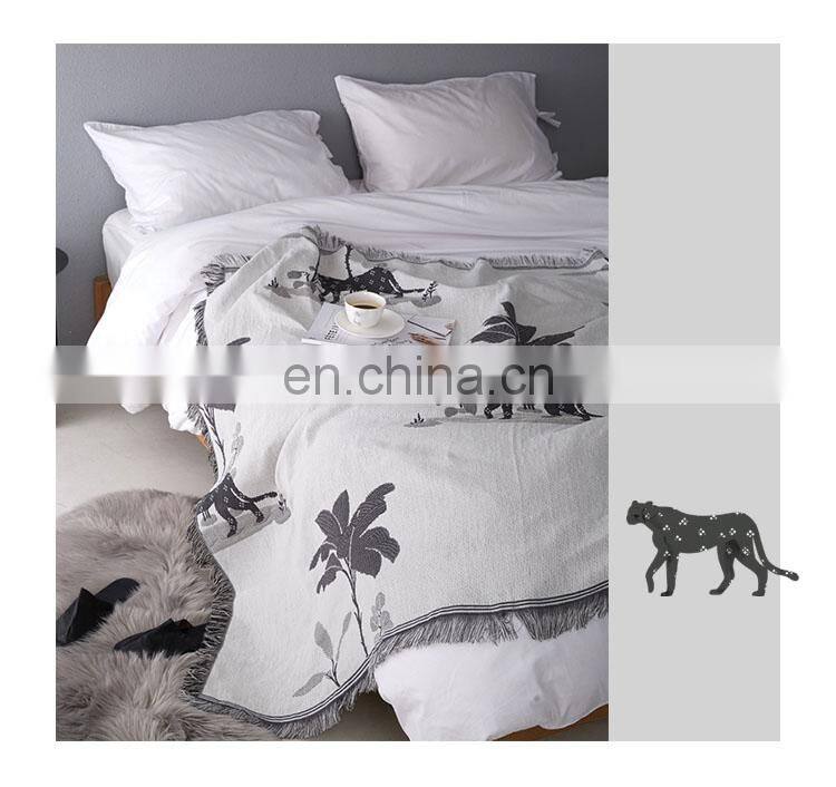 RAWHOUSE China wholesale throw blanket Yarn Dyed leopard double side woven throws tassels cover sofa home decor