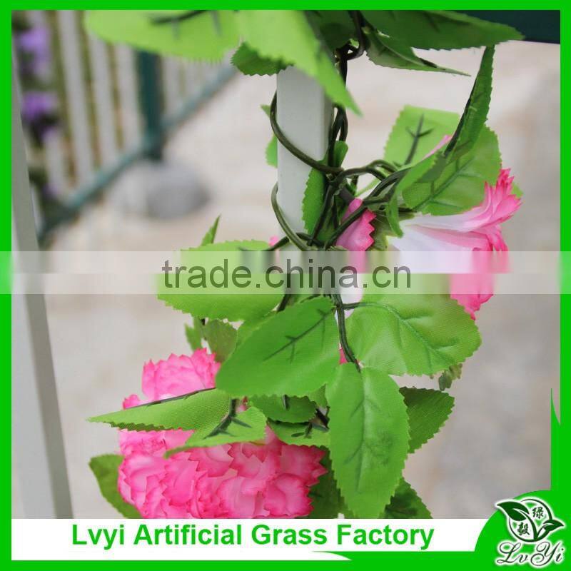 Artificial green leaf vine with flowers for decoration