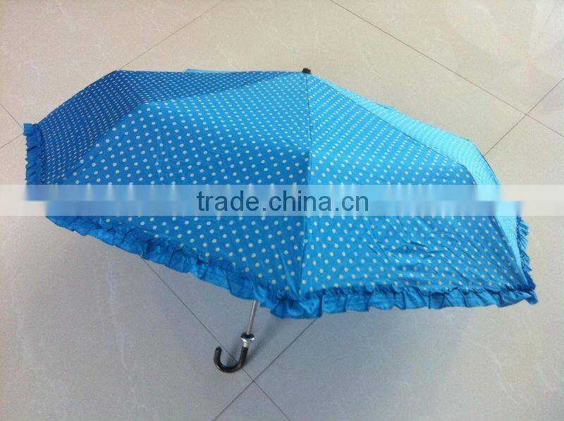 Beautiful lady folding umbrella