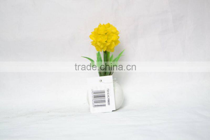 Artificial flower planted in ceramic pot for home decoration