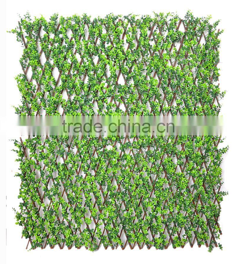 Garden trellis decorated with artificial plants