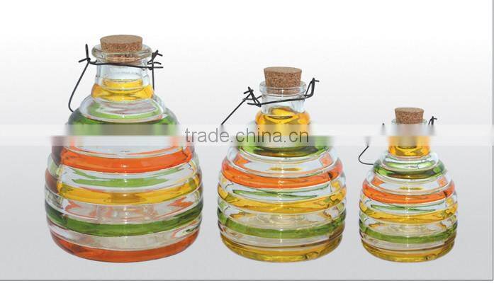 yellow glass bees catcher with cork stopper and hanging handle