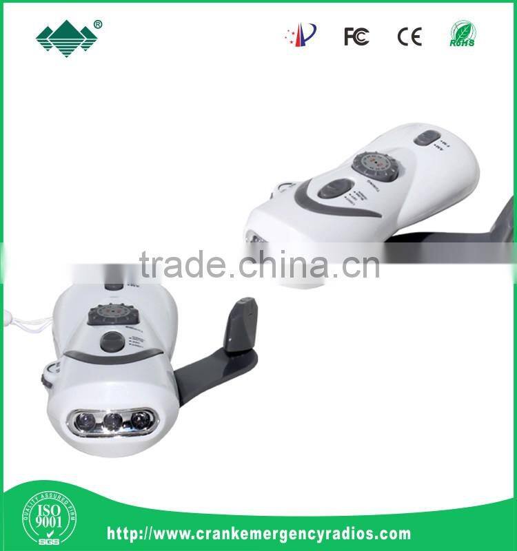 Dynamo hand crank flashlight radio with mobile phone chargers