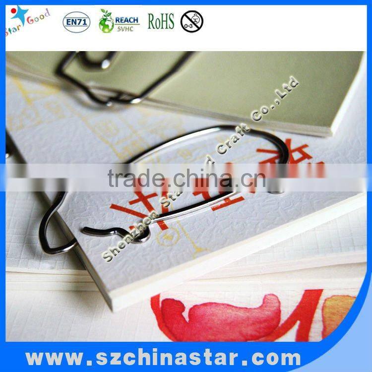 Metal penguin shaped paper clip as school supplies