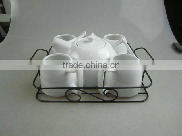 white porcelain tea set with metal stand
