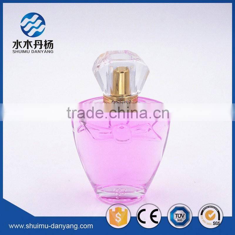 Hot sale 100ml clear glass perfume bottle with fancy cap