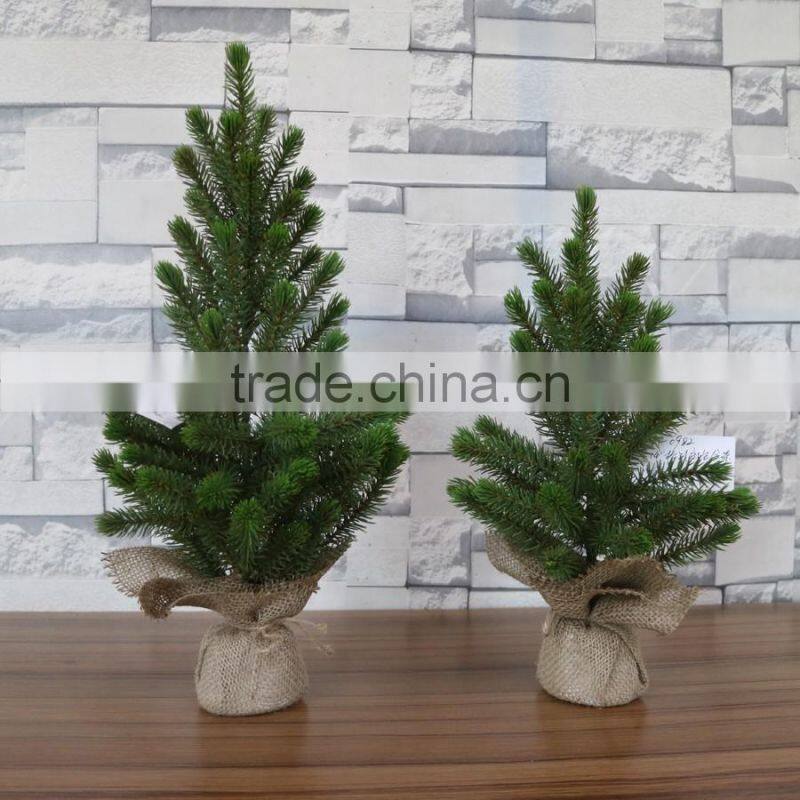 Plastic mini pine tree with burlap base for table decoration