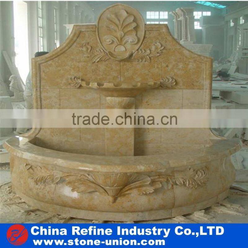 wall fountain carved with human figures