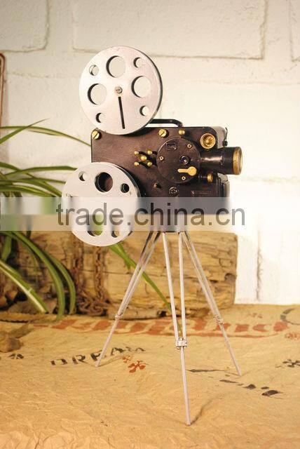 Antique metal movie camera model with paint