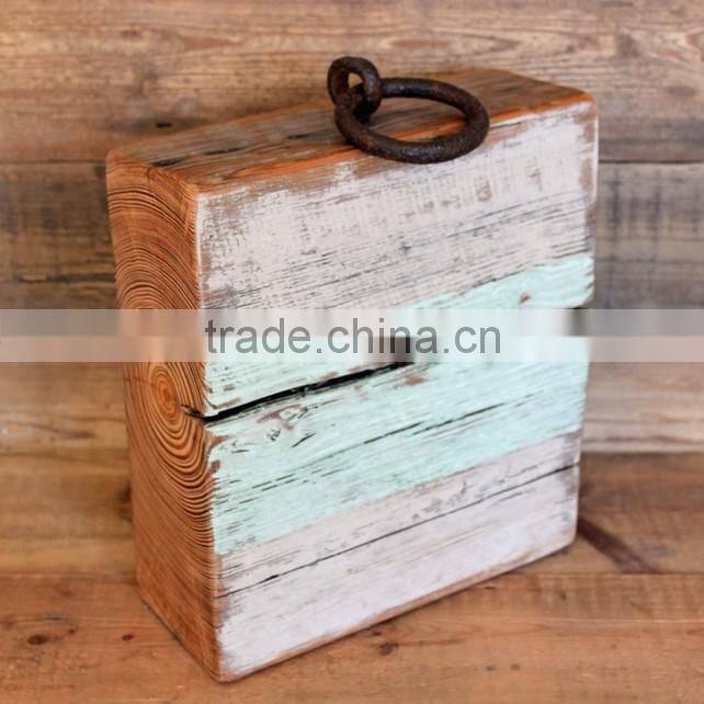 older aged wooden door stop