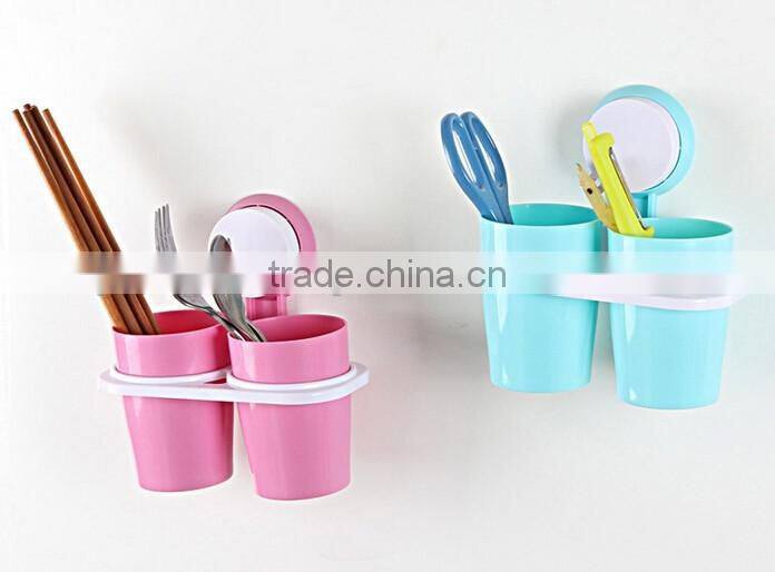 Adhesive toothbrush holder with suckers and two cups