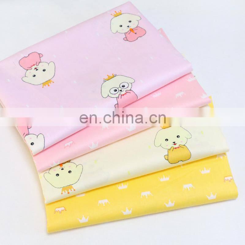Kindergarten baby cloth cartoon dog crown printed cotton twill fabric environment-friendly printing and dyeing fabric