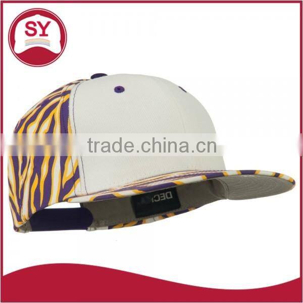 Short brim snapback hat with an adjustable plastic snapback strap closure