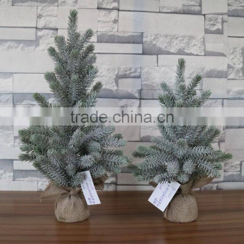 Plastic mini pine tree with burlap base for table decoration