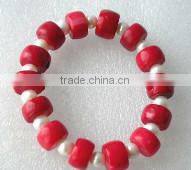 wholesale 7" pearls & 8-13mm china red drum shaped natural coral bracelet