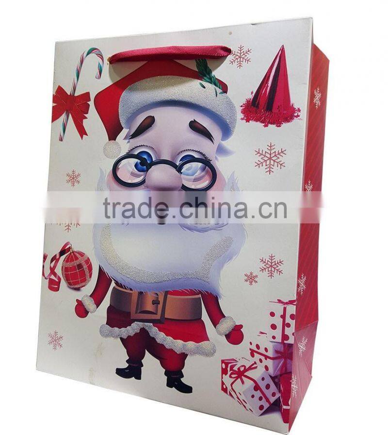 glittered paper shopping bag with Santa printing