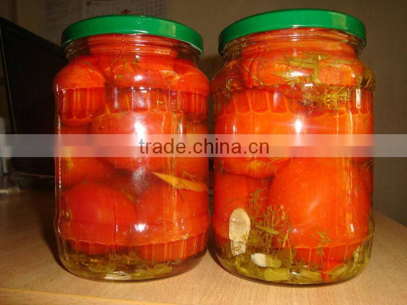 Pickled tomato in glass jar